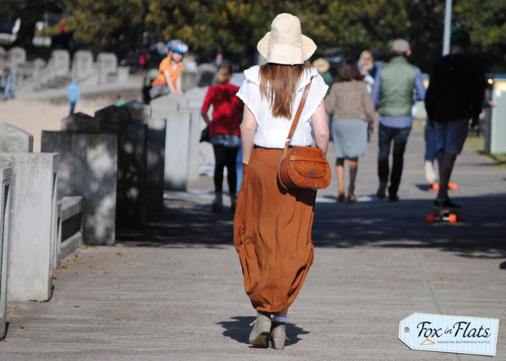 caramel skirt, leather bag, caramel hair
