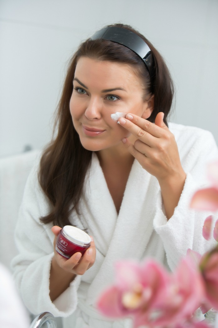 Andrea Michelle Fox in Flats applying Olay Regenerist Micro-Sculpting Cream